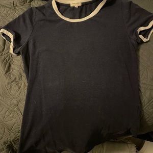 Blue tee shirt white around sleeves and collared. Size S